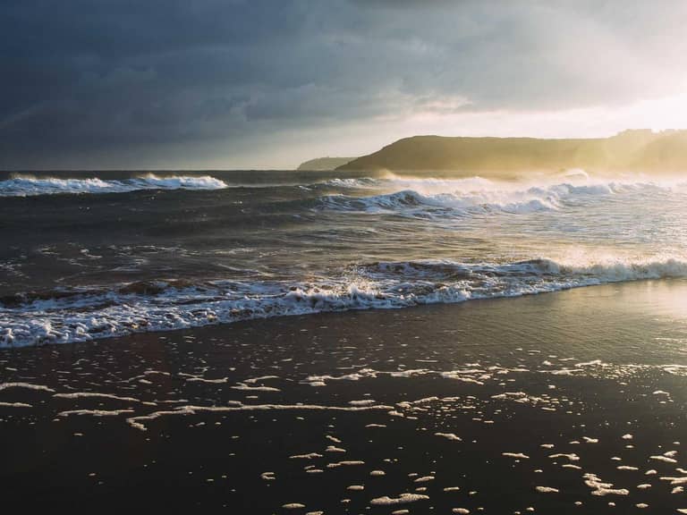 A popular Nigerian comedian performing on stage to a roaring audience.