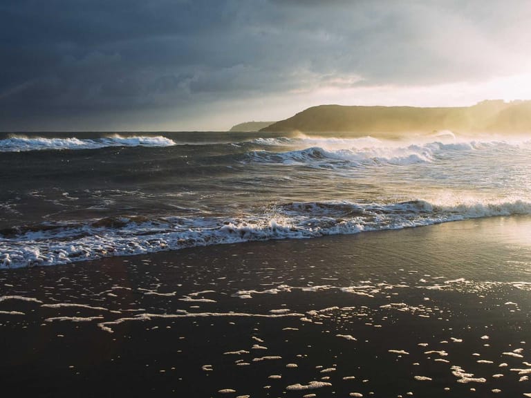 A popular Nigerian comedian performing on stage to a roaring audience.