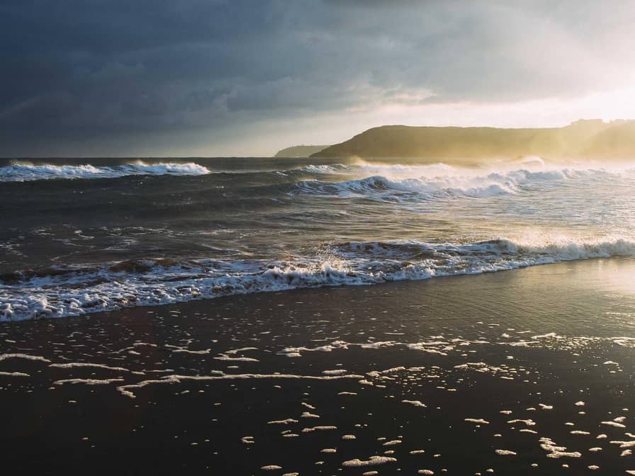 A popular Nigerian comedian performing on stage to a roaring audience.